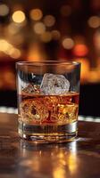 ai generato bicchiere di whisky con ghiaccio cubi su il di legno tavolo foto