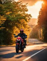 ai generato motociclista equitazione un' motociclo su un' nazione strada a tramonto. ai generativo foto