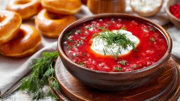 ai generato borscht con acida crema e aneto nel un' piatto. nelle vicinanze Là siamo ciambelle e lardo. generato di artificiale intelligenza. foto