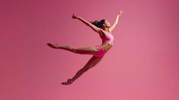 ai generato grazioso balletto ballerino saltare contro rosa sfondo foto