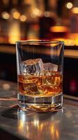ai generato bicchiere di whisky con ghiaccio cubi su il bar contatore. bicchiere di whisky con ghiaccio su bar contatore foto