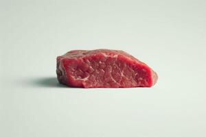 ai generato un' singolo isolato pezzo di crudo rosso carne è centrato contro un' bianca sfondo, evidenziazione suo struttura e colore. qualità e può essere Usato per culinario arti e nutrizione formazione scolastica foto