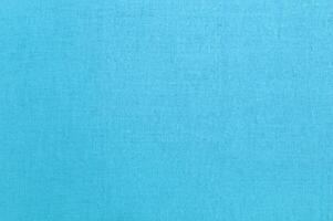 tranquillo leggero blu cotone tessuto struttura, della natura tessile armonia. foto