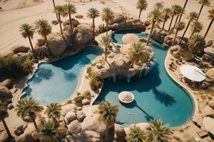 ai generato aereo Visualizza di un' a distanza deserto oasi con palma alberi e un' chiaro blu piscina. generativo ai foto