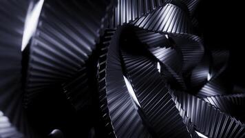 astratto metallo Filatura strisce su un' nero sfondo, monocromo. design. lungo ingarbugliato meccanismo. foto