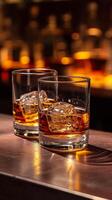 ai generato Due bicchieri di whisky con ghiaccio cubi su il di legno bar contatore foto