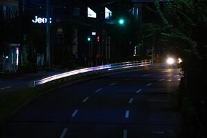 un' notte traffico marmellata a il centro strada nel tokyo lungo tiro foto