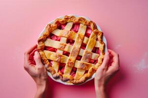 ai generato un' fornai mani preparazione un' rabarbaro torta, isolato su un' pendenza sfondo foto