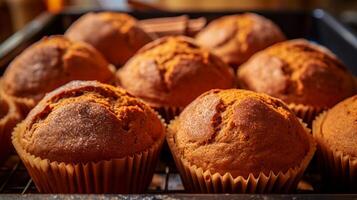 ai generato avvicinamento di al gusto di zucca muffin fresco su di il forno. generativo ai foto