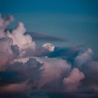 ai generato Luna sbircia attraverso ondeggiante nuvole, la creazione di un' mistico ambiance per sociale media inviare dimensione foto