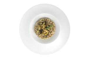 grano saraceno porridge con funghi isolato su bianca sfondo foto