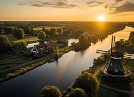 ai generato aereo Visualizza di fiume e mulini a vento a tramonto foto