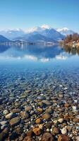 ai generato maestoso montagne circostante roccioso lago foto