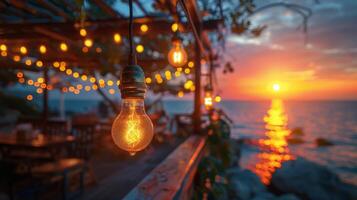 corda luci creare un' festivo ambiance su un' di fronte al mare ponte contro il fondale di un' sbalorditivo oceano tramonto. foto