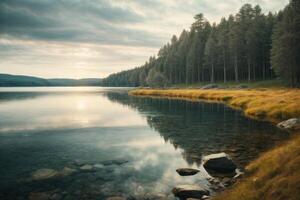 un' bellissimo lago circondato di alberi e rocce foto