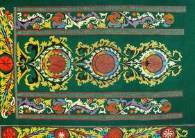 colorato Vintage ▾ tappeto fatto di mano. orientale cucito di il 19 secolo. astratto sfondo. foto
