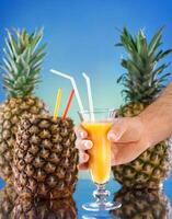 ananas e succo bicchiere foto