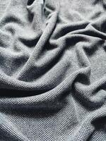 struttura e sfondo di grigio abbigliamento sportivo tessuto calcio maglietta foto