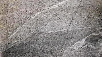 struttura di marmo grigio. il motivo di fondo naturale può essere utilizzato per creare l'effetto superficiale della lastra architettonica, dei pavimenti e dei rivestimenti ceramici. struttura in pietra, distesi piatti, copia spazio. foto
