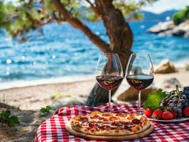 mare picnic con rosso vino nel occhiali, peperoni Pizza, e fresco uva su scacchi lenzuolo. romantico all'aperto cenare concetto con un' mare Visualizza e naturale ambientazione. ai generazione foto