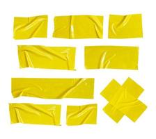 nastro di plastica stropicciato giallo per elementi decorativi. una raccolta di cerotto adesivo su uno sfondo bianco. il nastro adesivo incollato strappato in varie trame.