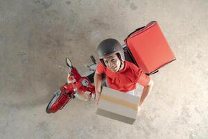 consegna ciclista preparazione pacchetto Il prossimo per motociclo foto