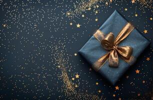 regalo scatola su blu sfondo con oro stelle foto