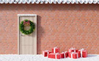 facciata con neve, porta e doni a terra foto