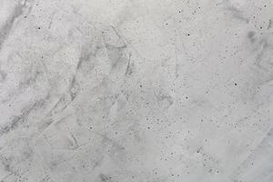 sfondo cemento grigio chiaro con strisce maculate e screziate. foto