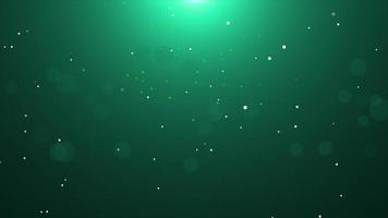 particella bagliore cadente verde con sfondo bagliore foto