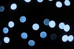 luce blu sfocatura colorata ray glitter sfocatura texture di natale luce astratta foto