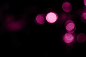 sfondo sfocato rosa scuro multicolore e sfondo cerchio e cerchio astratto sfocatura effetto luci natalizie foto