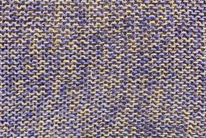 lo sfondo e la trama della tessitura del tessuto a maglia di lino ecologico di colore blu-beige foto