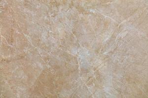 la superficie, la trama e lo sfondo del marmo beige con piccole crepe biancastre. foto