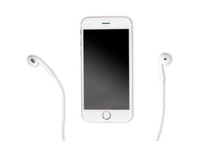 smartphone e auricolare su sfondo bianco foto