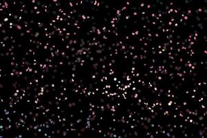 scintilla bianca astratta elegante effetto di luce su uno sfondo nero e scintilla particelle di polvere magiche scintillanti su nero foto