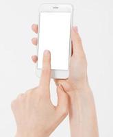 telefono cellulare della tenuta della mano femminile isolato su bianco, telefono della tenuta della donna con il display vuoto, schermo vuoto, toccante foto