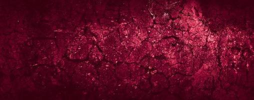 fondo di struttura del muro di cemento dell'estratto di lerciume spaventoso rosso scuro foto