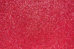astratto rosso festivo scintilla sfondo glitter. foto