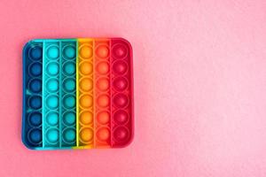 fidget pop it toy color arcobaleno, antistress, divertente ed educativo foto