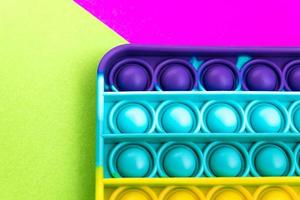 fidget pop it toy color arcobaleno, antistress, divertente ed educativo foto