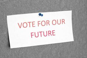 vota per il nostro segno futuro. il concetto di votare, fare delle scelte. foto