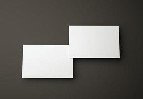 illustrazione 3d. mockup di due biglietti da visita modello di progettazione su sfondo nero isolato. concetto di identità aziendale e di branding. foto