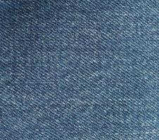 fondo di struttura del tessuto dei jeans blu foto