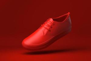 scarpa rossa fluttuante su sfondo rosso. idea di concetto minimale creativa. rendering 3d. foto