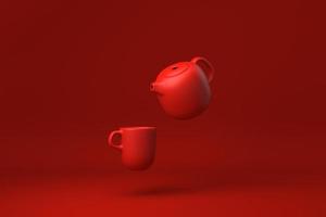 teiera rossa e tazze galleggianti su sfondo rosso. idea di concetto minimale creativa. monocromo. rendering 3d. foto