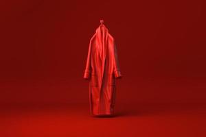 accappatoio rosso su sfondo rosso. idea di concetto minimale creativa. monocromo. rendering 3d. foto