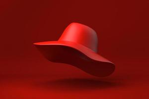 cappello da sole rosso che galleggia su sfondo rosso. idea di concetto minimale creativa. monocromo. rendering 3d. foto