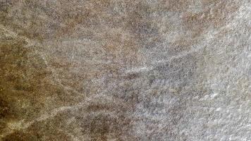 struttura di granito, fondo di granito, pietra di granito. pitture per pavimenti e pareti in pietra e colore della superficie di marmo e granito, materiale per decorare lo sfondo della trama, design d'interni. foto