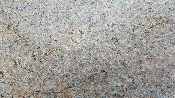 struttura di granito, fondo di granito, pietra di granito. pitture per pavimenti e pareti in pietra e colore della superficie di marmo e granito, materiale per decorare lo sfondo della trama, design d'interni. foto